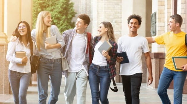 Group of students walking through campus