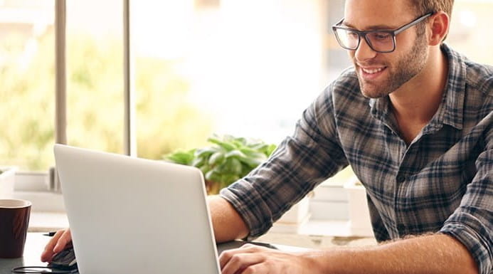Image of man using a laptop