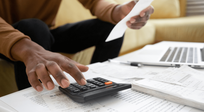 Man calculating figures